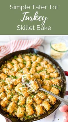 a skillet filled with tater tots on top of a table