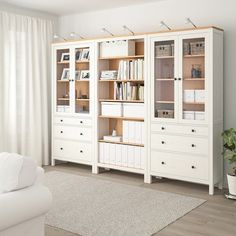 a living room filled with furniture and a white couch