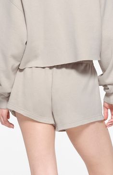 Keep your look laid-back and luxe in casual sweat shorts made from supersoft cotton-blend fleece in a relaxed fit brought to you by Kim Kardashian's SKIMS. 3" inseam; 28" leg opening; 10 1/2" front rise; 16" back rise (size Medium) Elastic waist 70% cotton, 30% polyester Machine wash, tumble dry Imported Relaxed Fit Bottoms With Built-in Shorts For Loungewear, Athleisure Moisture-wicking Pajama Shorts, Compressive Sweat-resistant Sports Shorts, Solid 4-way Stretch Loungewear Shorts, Compressive Sweat-resistant Nylon Shorts, Hairstyling Products, Led Fashion, Rollerball Perfume, Beauty Sale