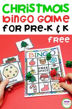 the christmas bingo game for prek and k is shown with two hands on it