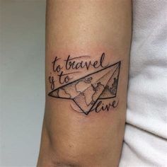 a woman's arm with a tattoo that reads to travel is to live