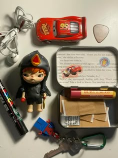 an assortment of toys and other items laid out on top of a white countertop