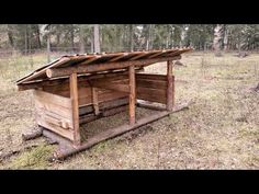 a chicken coop in the middle of a field