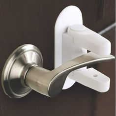 the door handle is attached to an open door with a hook on it and two white handles