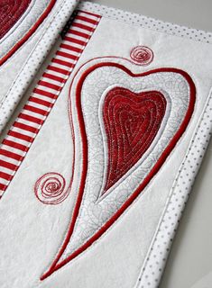 two red and white handmade valentine's day cards, one with a heart on it