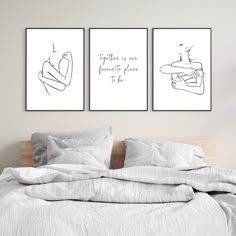 two prints on the wall above a bed