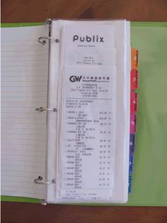 a binder is open to show the contents of a file book, which has been printed on