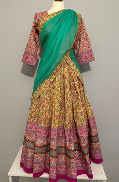 Fancy gopi dress made in Vrindavan. It includes a skirt with a sewn-in petticoat, a blouse (choli) and a shawl (dupatta). The skirt is rich with a thick border. It has a zipper and an adjustable drawstring waist. It has a beautiful twirling capacity. The blouse has double seams, so if the first ones are removed, the blouse can be increased by one size. This gopi dress is a medium size (European size 40). However it is not needed to strictly follow the sizes. It is better to follow the measuremen Bohemian Green Cotton Anarkali Set, Green Bohemian Cotton Anarkali Set, Multicolor Anarkali Set For Transitional Season, Block Print Lehenga For Navratri, Bohemian Green Anarkali Set With Block Print, Transitional Multicolor Sharara With Traditional Drape, Traditional Drape Multicolor Lehenga With Kalamkari Print, Traditional Drape Multicolor Lehenga, Multicolor Lehenga With Kalamkari Print In Traditional Drape