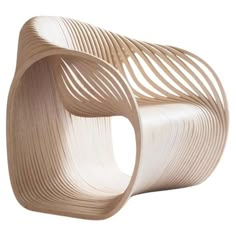 an unusual wooden chair with wavy lines on it