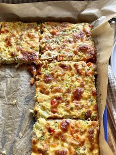 the pizza is cut into squares and ready to be eaten