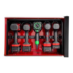 a red box with four different types of drillers in it's storage compartment