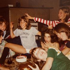 a group of young people sitting around each other