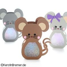 three paper mouses sitting next to each other