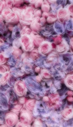 pink and purple flowers are mixed together in this image with blurry effect to make it look like they have been made out of yarn