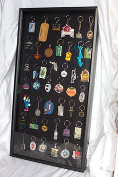 a black frame with many different key chains on it