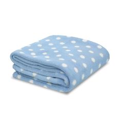 a blue blanket with white polka dots on it