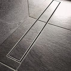 a tile floor with square and rectangle design