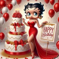 a woman in a red dress standing next to a birthday cake