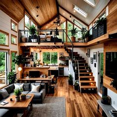 a living room filled with furniture next to a staircase leading up to a second story