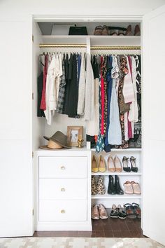 an organized closet with clothes and shoes