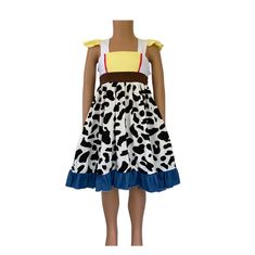 a mannequin wearing a dress made out of cow print