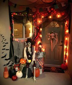 a decorated house with halloween decorations and lights