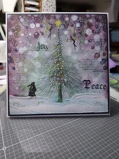 a card with a christmas tree on it