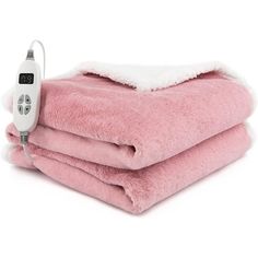 a pink blanket with a thermometer on it sitting next to two other blankets