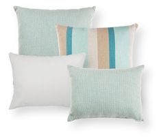 three pillows with different colored stripes on them