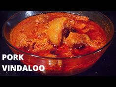 pork vindalloo in a glass bowl with the words pork vindallo on it