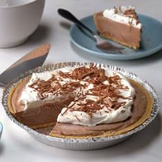 there is a pie on the table ready to be eaten and served for desserts