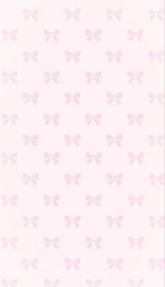 a pink wallpaper with bows on it