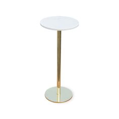 a white table with a gold metal base