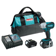 a cordless drill with two batteries and a tool bag