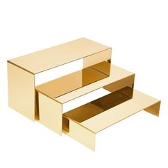 two open boxes sitting side by side on top of each other, one is gold and the other is white