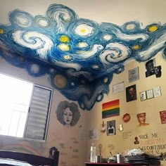 a bedroom with a painting on the ceiling that looks like starrdusts and clouds