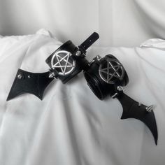 This is a dark pentagram bat wing wristband armlet punk bracelet， it is very cool and suitable for matching with punk-style clothing.  The price includes only a pair of bracelets, other items are not included. Punk Style Bracelets With Wrist Strap For Festival, Gothic Black Wristband For Festivals, Black Gothic Leather Bracelet For Festivals, Black Gothic Festival Wristband, Gothic Black Wristband For Halloween, Black Gothic Wristband For Concert, Gothic Black Wristband For Party, Black Gothic Wristband For Party, Black Metal Gothic Wristband