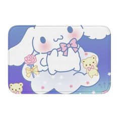 a bath mat with an image of a bunny holding a rose in its hand and two teddy bears on the other side