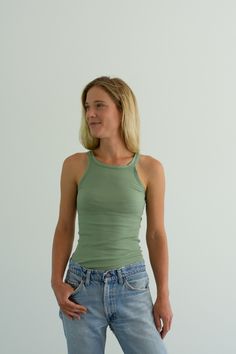 "Best ribbed green tank. Maker: Military Material: 100% cotton stretches Condition: Excellent. Washed Deadstock. XS Chest: 11\" flat un-stretched | Length: 24\" S Chest: 13\" flat un-stretched | Length: 25\" Annika is 5'8\" and is wearing a size X-Small here. SHOP http://www.rawsonstudio.etsy.com FOLLOW US + instagram | @_rawson + website | www.shoprawson.com + pinterest | rawson **Please see shop policies for exchange information*" Solid Ribbed Tops With Tank Straps, Solid Ribbed Tank Straps Tops, Green Fitted Trendy Tank Top, Trendy Green Tank Top, Trendy Green Tops With Tank Straps, Fitted Green Tank Top For Spring, Green Cotton Camisole With Tank Straps, Casual Green Stretch Tank Top, Basic Green Tank Top