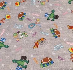 the fabric is very colorful and has many cartoon characters on it, including an american football player