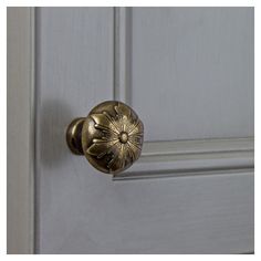 a close up of a door handle on a white door