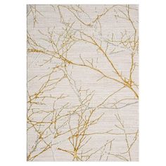 a white rug with gold branches on it