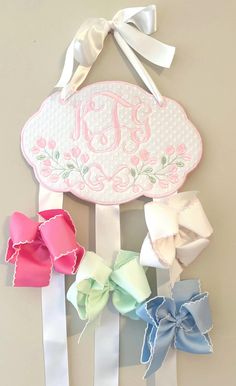 this is an image of a wall decoration with ribbons and bowes on the side