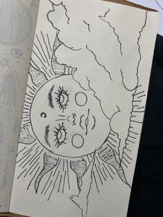 a drawing of an evil face on paper