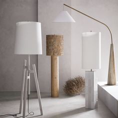 the floor lamp is next to other lamps