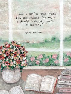 an open book sitting on top of a table next to a vase filled with flowers