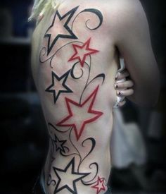 the back of a man's body with stars and swirls on it