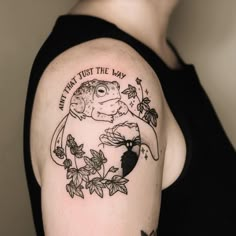 a woman with a tattoo on her arm that says, what trust the frog?