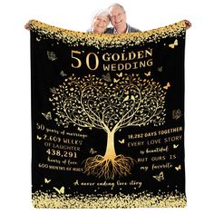 the 50th wedding anniversary gift for couple with golden tree and gold glitters on black background