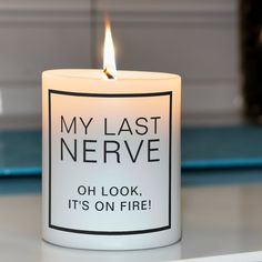 a lit candle that says, my last nerve oh look it's on fire